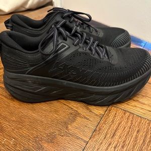 Women’s HOKA black on black sneakers
